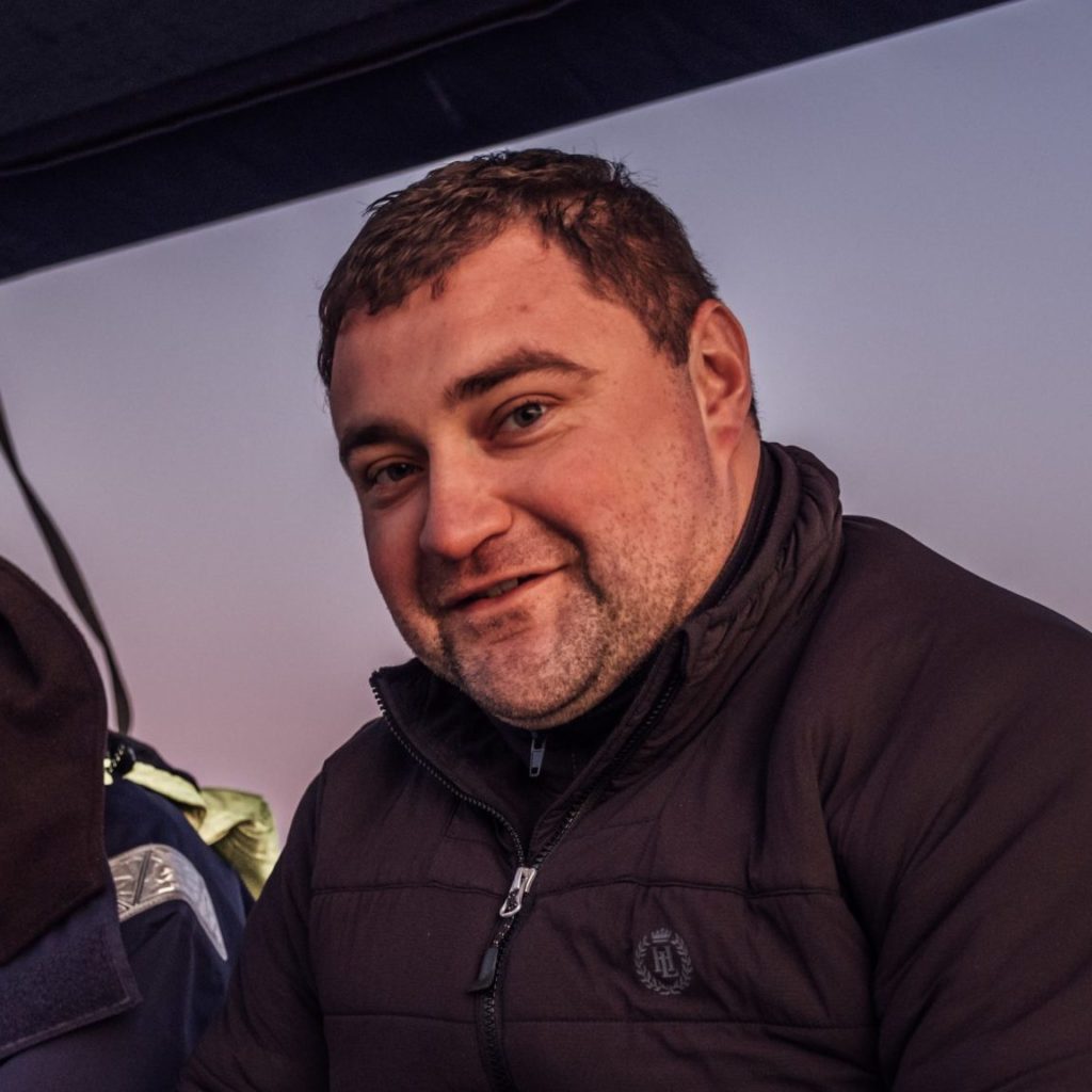 Zdjęcie profilowe Wojciech Sajdak, uśmiechnięty, w kurtce